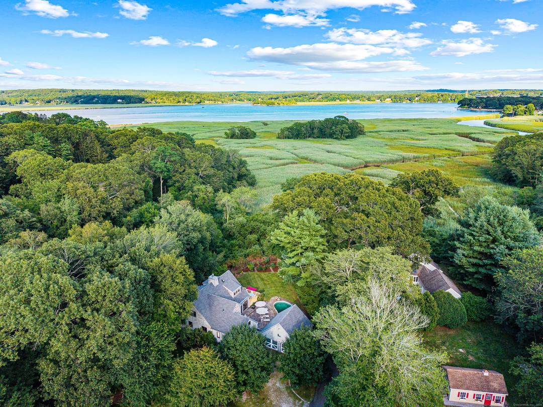 Discover the serenity of Ayers Point in this spacious 3400 sq ft home with captivating views of the Connecticut River and surrounding marshland.