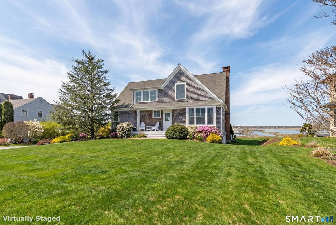 Perched high above the flood plains, this pristine coastal retreat captures sweeping views of the Neck River as it opens into the Long Island Sound.