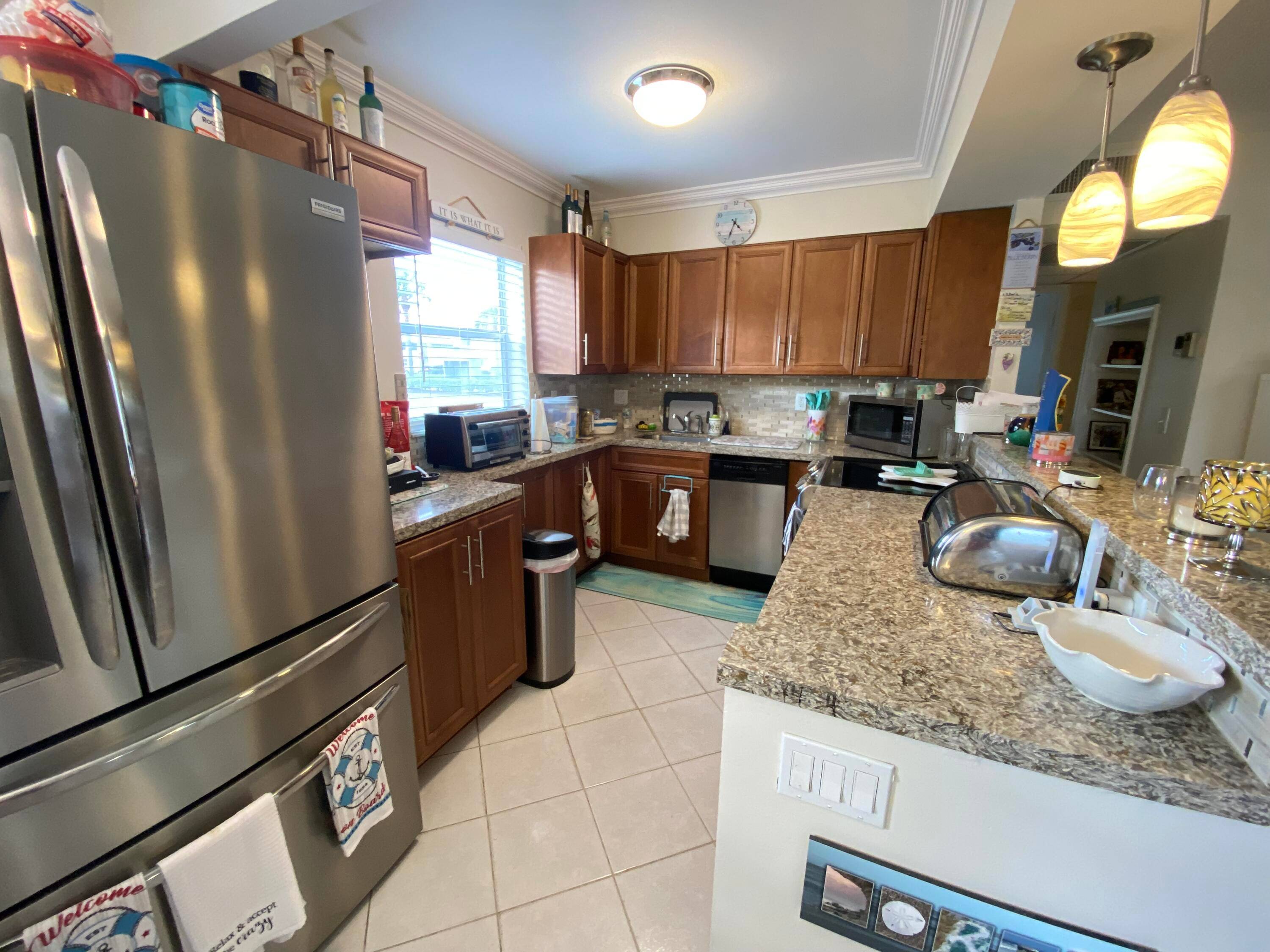 THIS IS THE ONE ! ! ! True corner Condo 1st floor 2 Bed 2 Bath steps from Monaco Clubhouse.