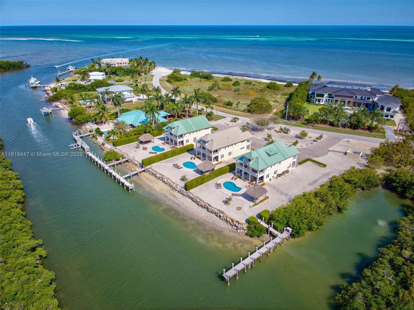 Welcome to an unparalleled collection of THREE designer residences on one of the most exclusive waterfront parcels in the Florida Keys.
