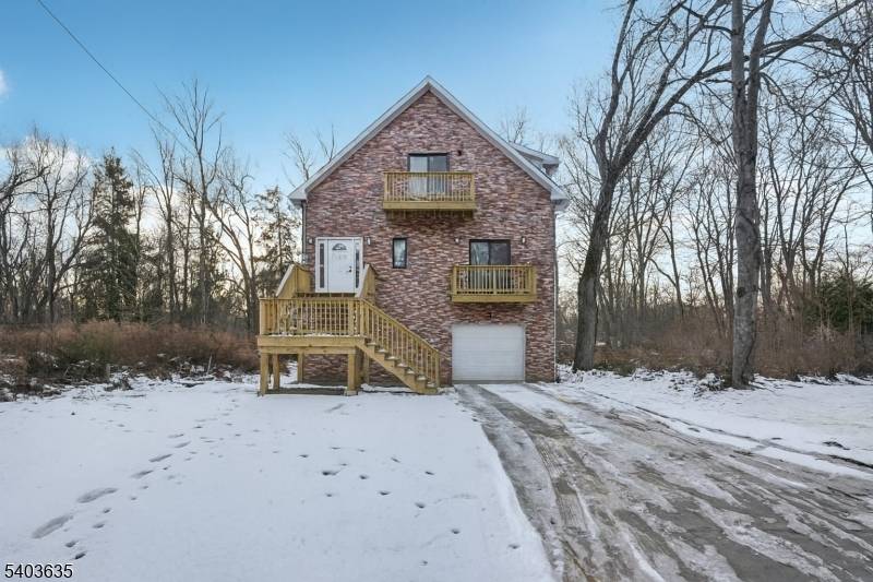 Welcome home to this newly constructed 3 bedroom, 3 bathroom Colonial nestled on a wooded lot in the heart of Wayne, where modern design meets everyday comfort.