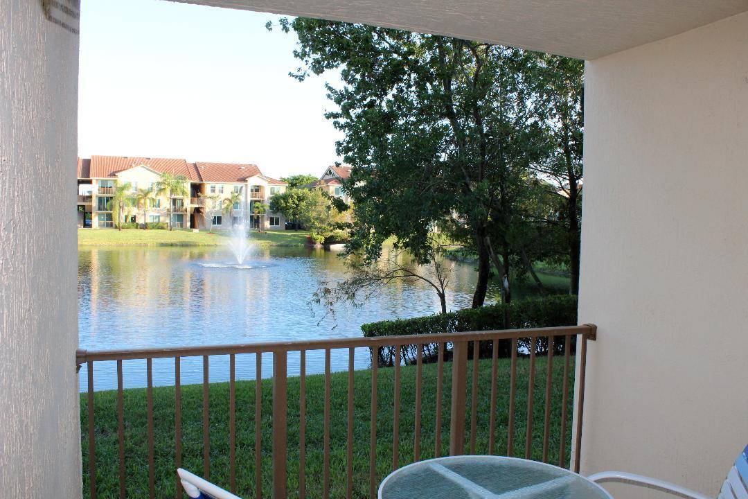 Lovely impeccably maintained 3 bedroom 2 bath condo with desirable split floor plan, lake views, modern kitchen, and enclosed patio.
