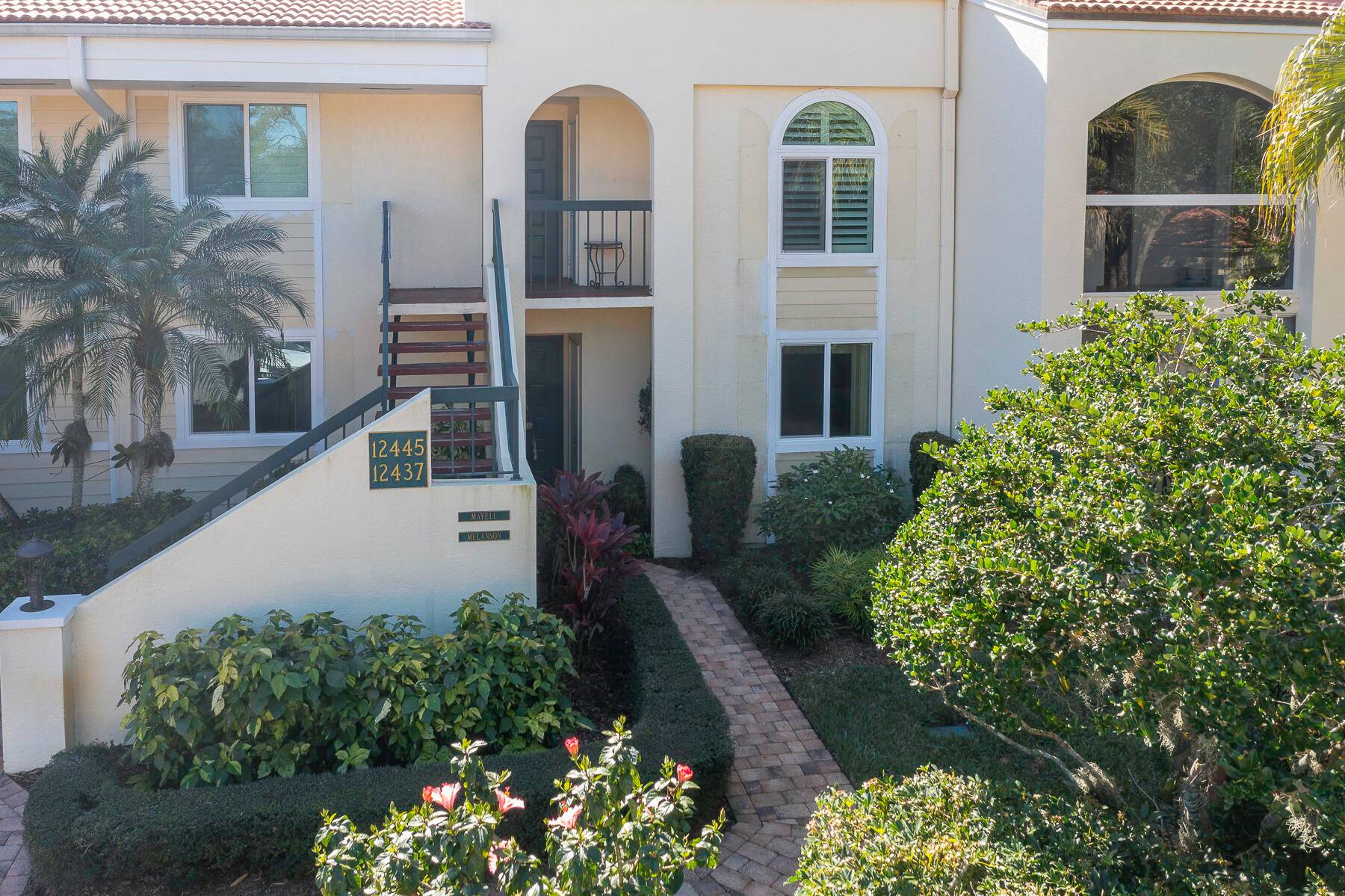 Wonderful first floor 3 bedroom 2 bath condo with carport and golf cart garage.
