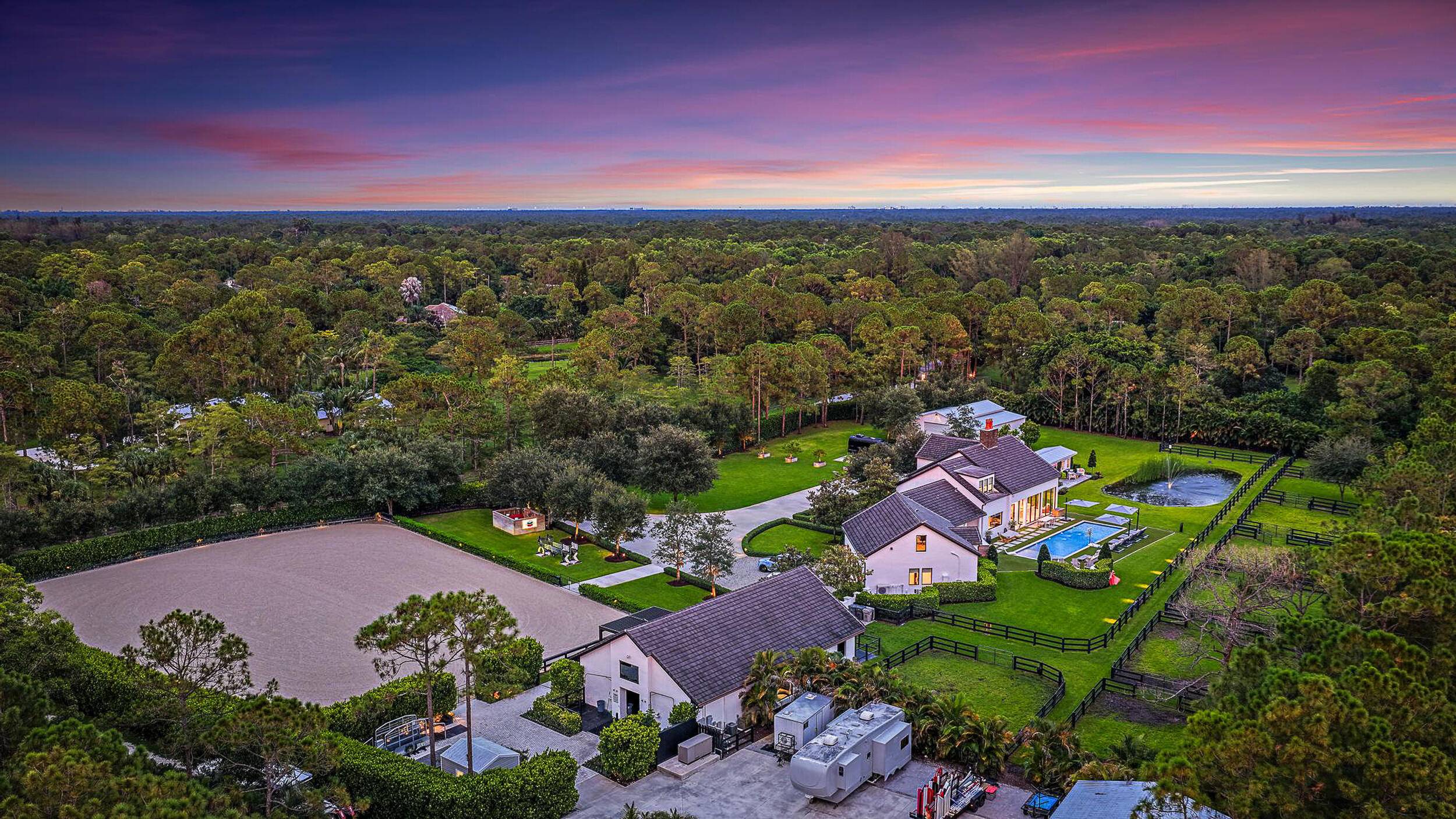 This completely reimagined estate combines timeless charm with modern luxury on 5 private acres in Palm Beach Gardens' coveted equestrian community of Caloosa.