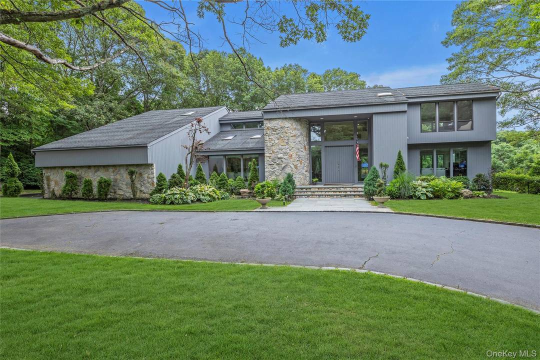 Tucked away at the end of a serene cul de sac, this spectacular modern retreat is situated on 2.