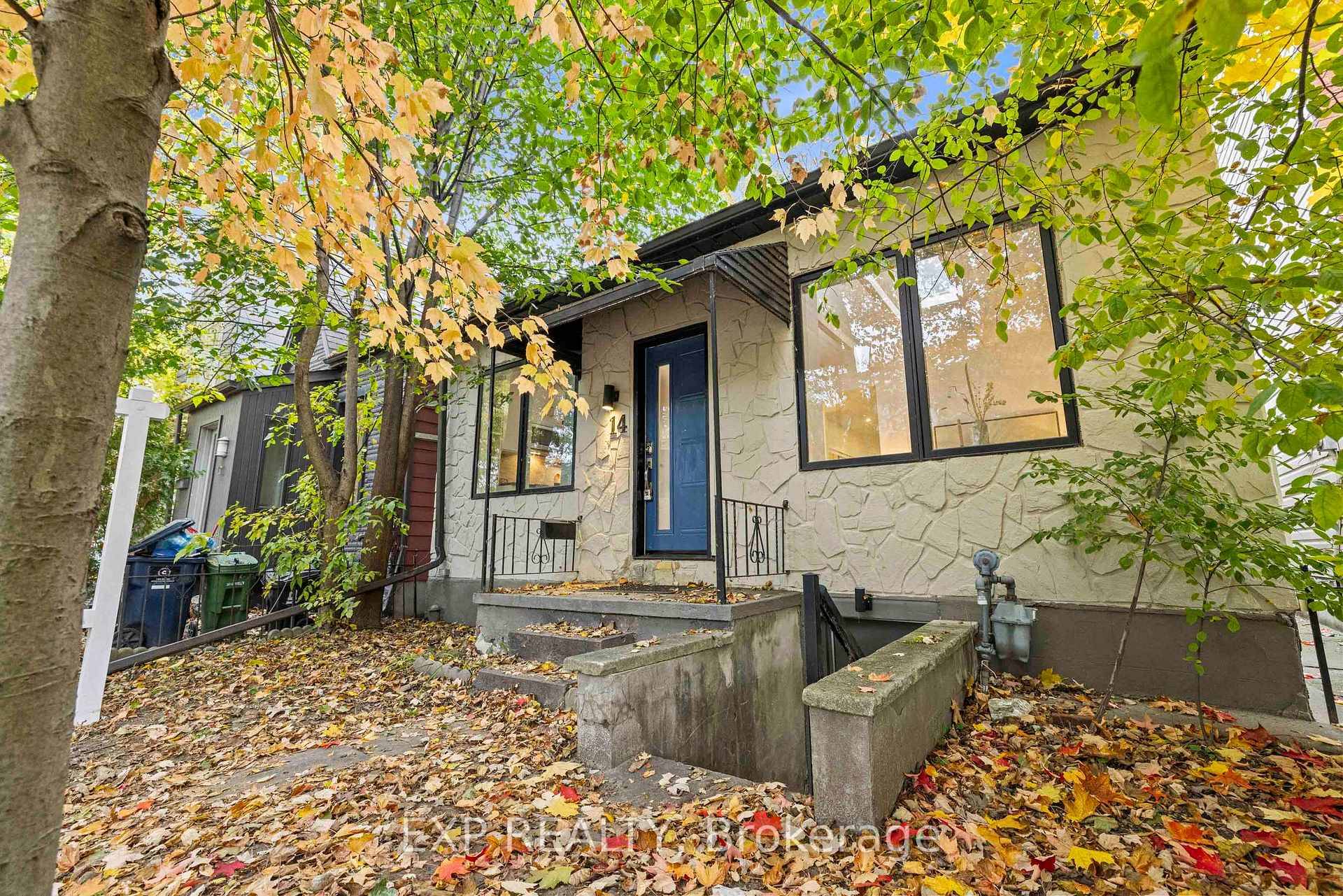 Framed by mature maples and a charming stone fac ade, this inviting 2 bed, 2 bath bungalow welcomes you with a crisp blue front door, black trim windows and a ...