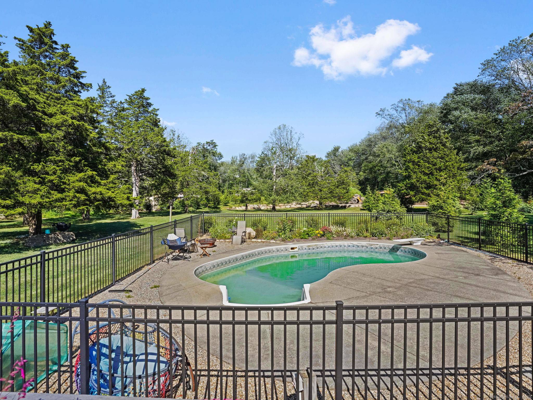 Spacious 3 bedroom ranch with in ground pool and sweeping property in the heart of Easton.