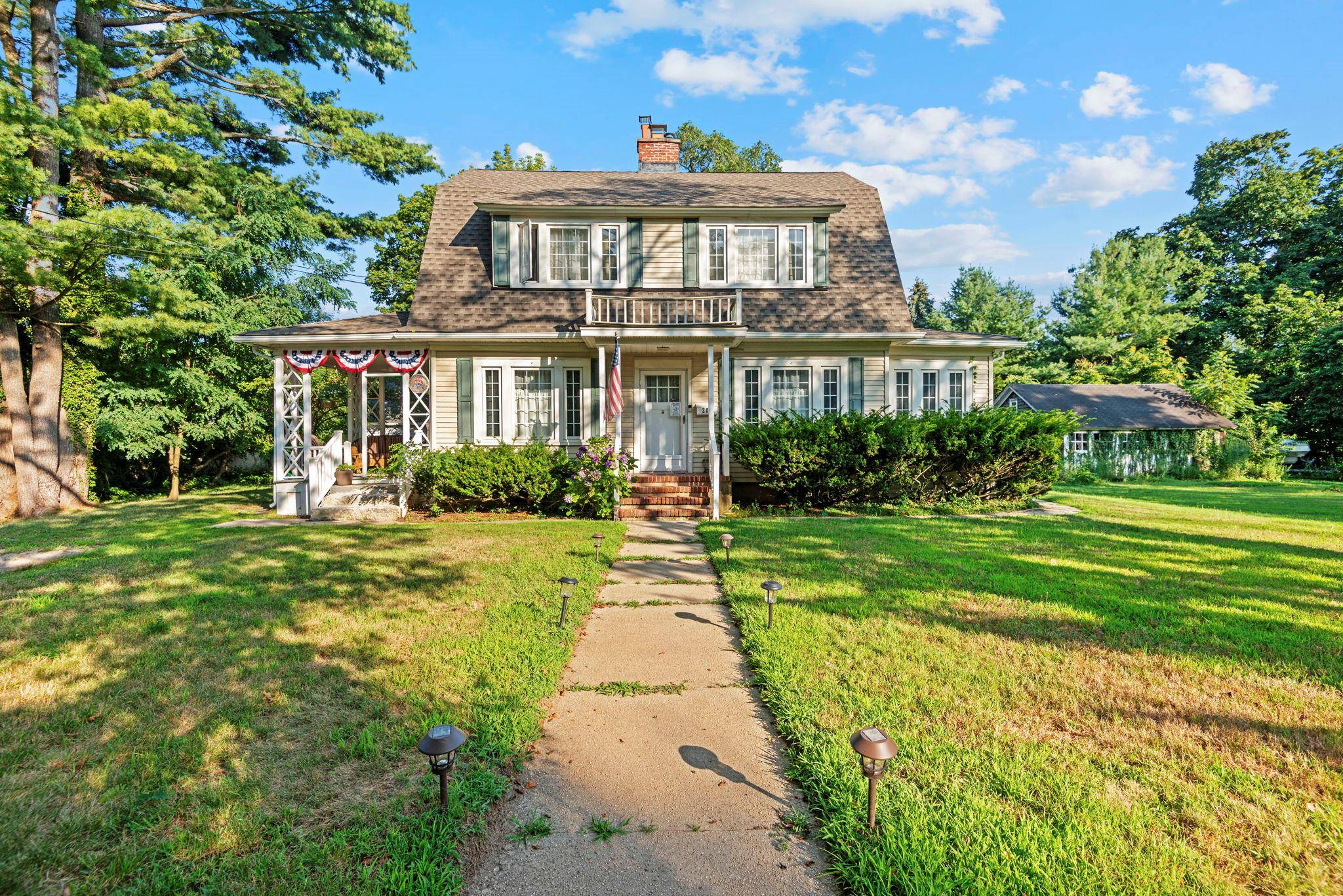 This Charming Turn of the Century Colonial sits on.