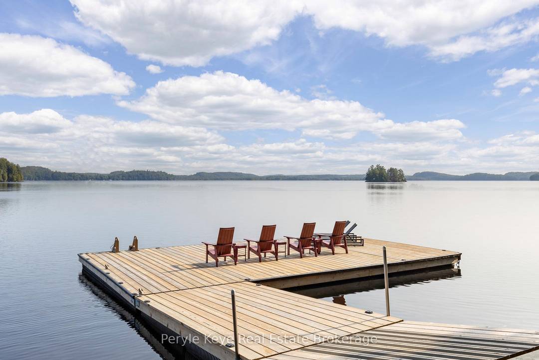 A masterclass in lakefront living, capturing the finest of views over Lake Vernon !