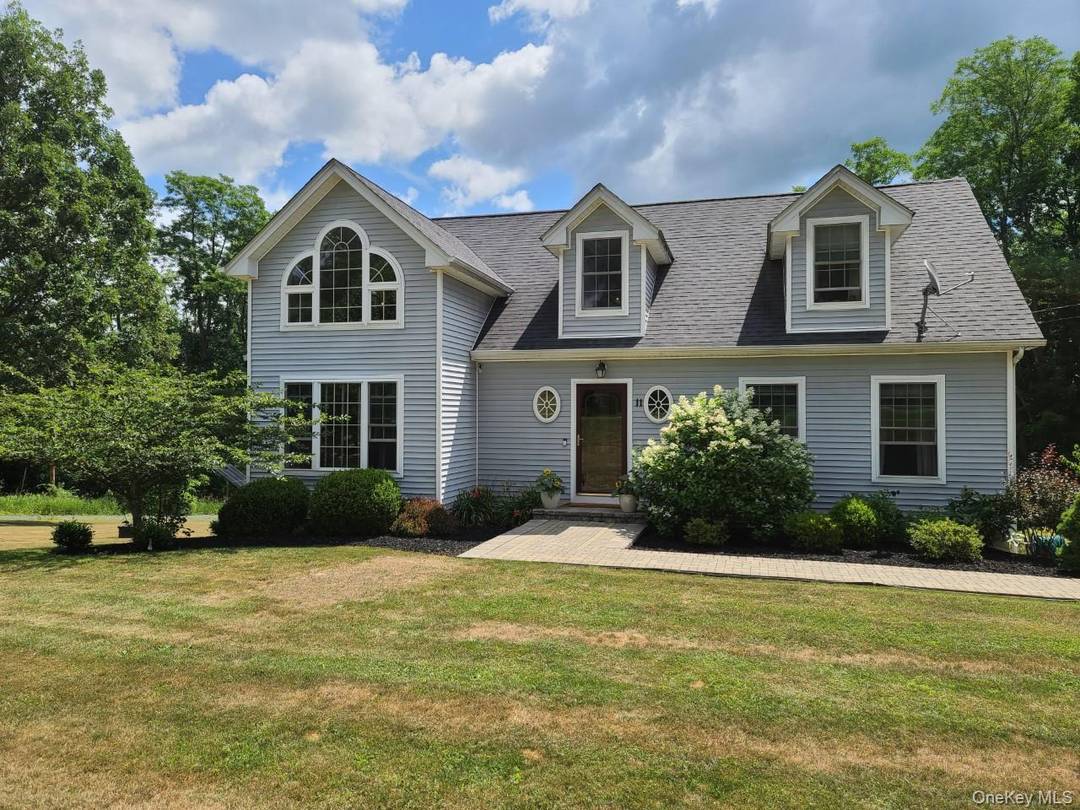 COUNTRY ELEGANCE fully furnished for comfort and convenience with views of Round Lake for all season enjoyment.