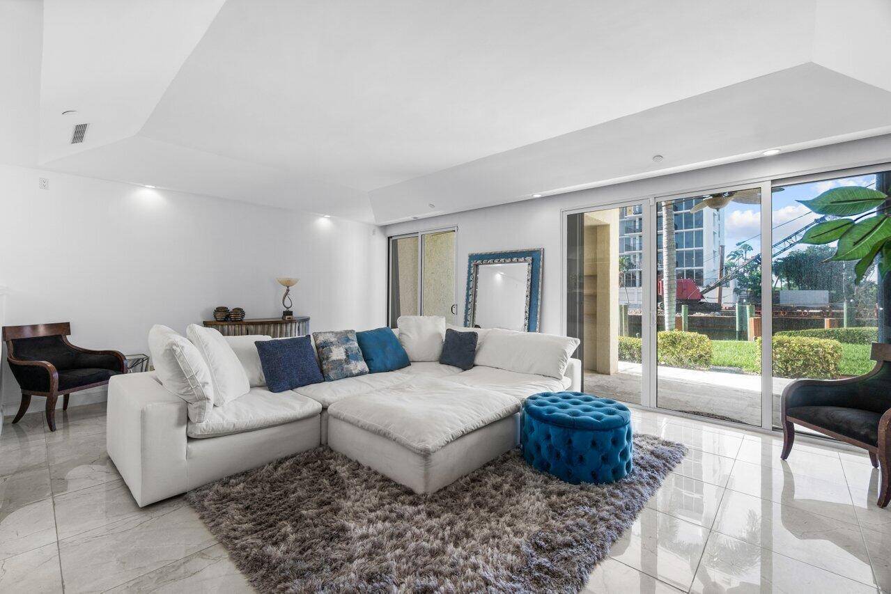 This rarely available, corner townhome in the prestigious Braemar Isle of Highland Beach is ready for you !