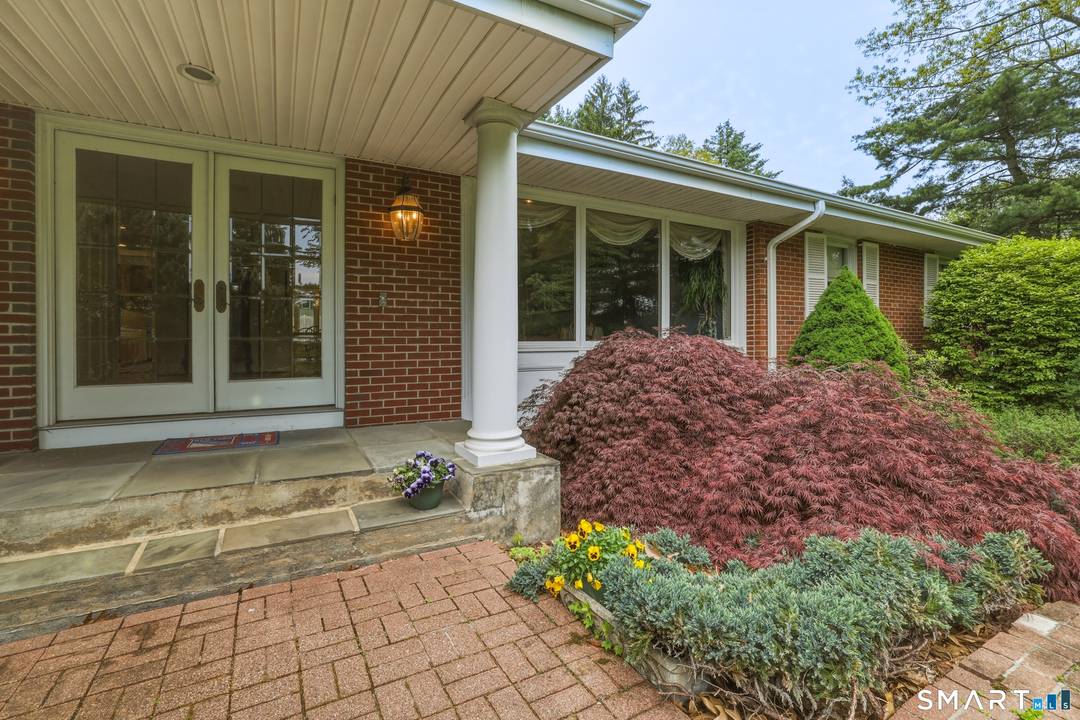 Soaring cathedral ceilings, walls of windows, open floor plan, and lovely screened porch define this contemporary 4 bedroom, 3.