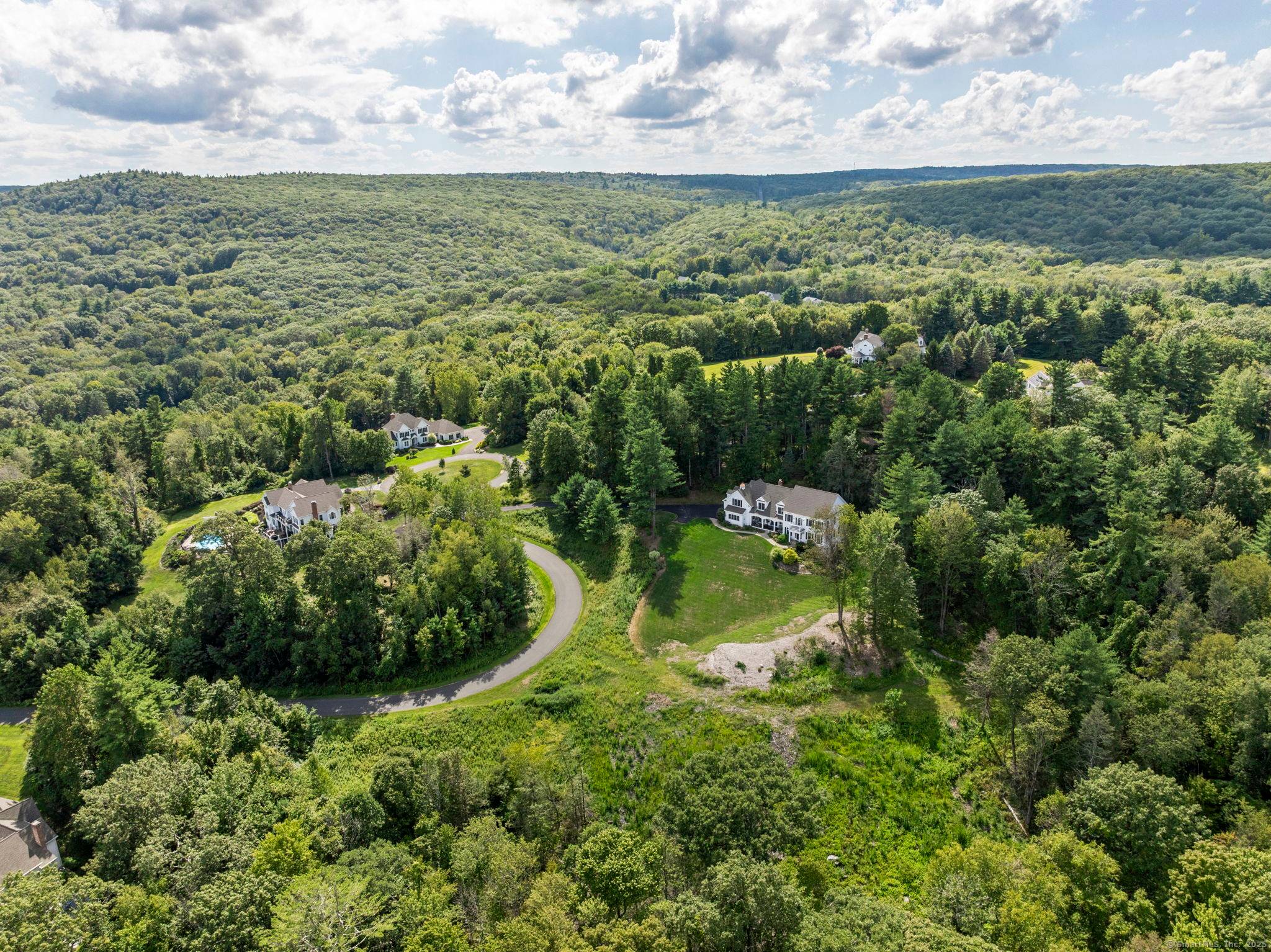 One of just eight custom homes in a 64 acre enclave inspired by the iconic white houses of Newfane, Vermont.