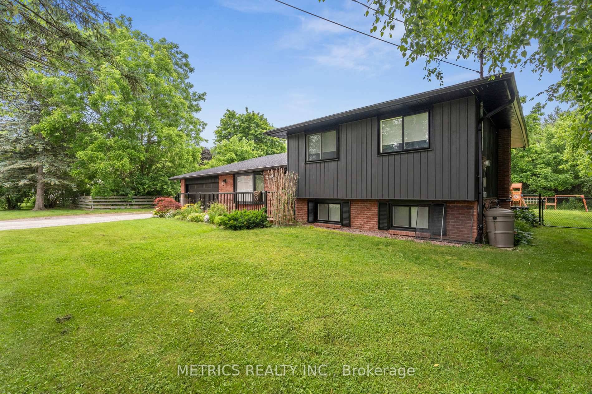 Discover this beautifully updated side split home just a short stroll from Lake Simcoe !