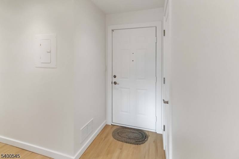 Gorgeous NYC style oversized one bedroom end unit condo in a secure building with an oversized garage and ample additional parking.