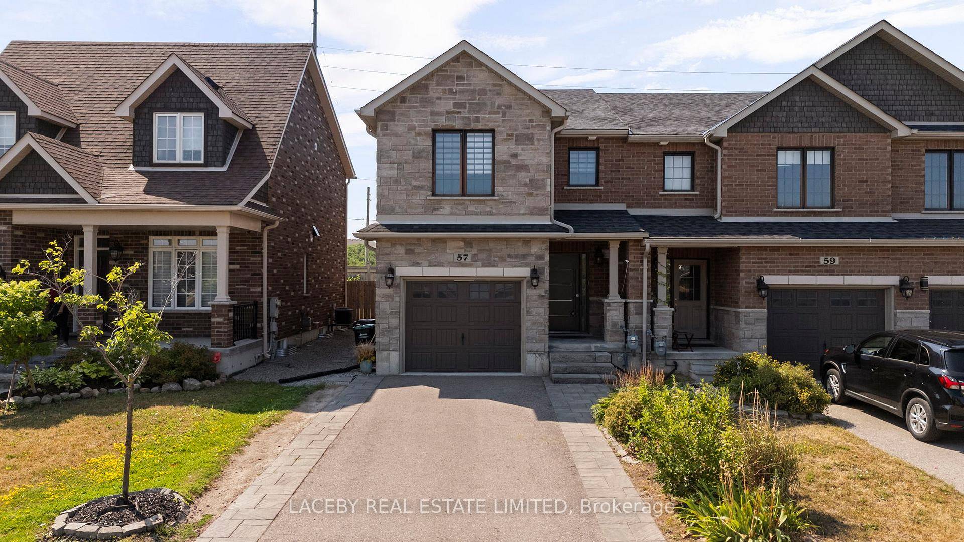 End Unit Freehold Townhouse In Desirable South East Barrie with Private Driveway.