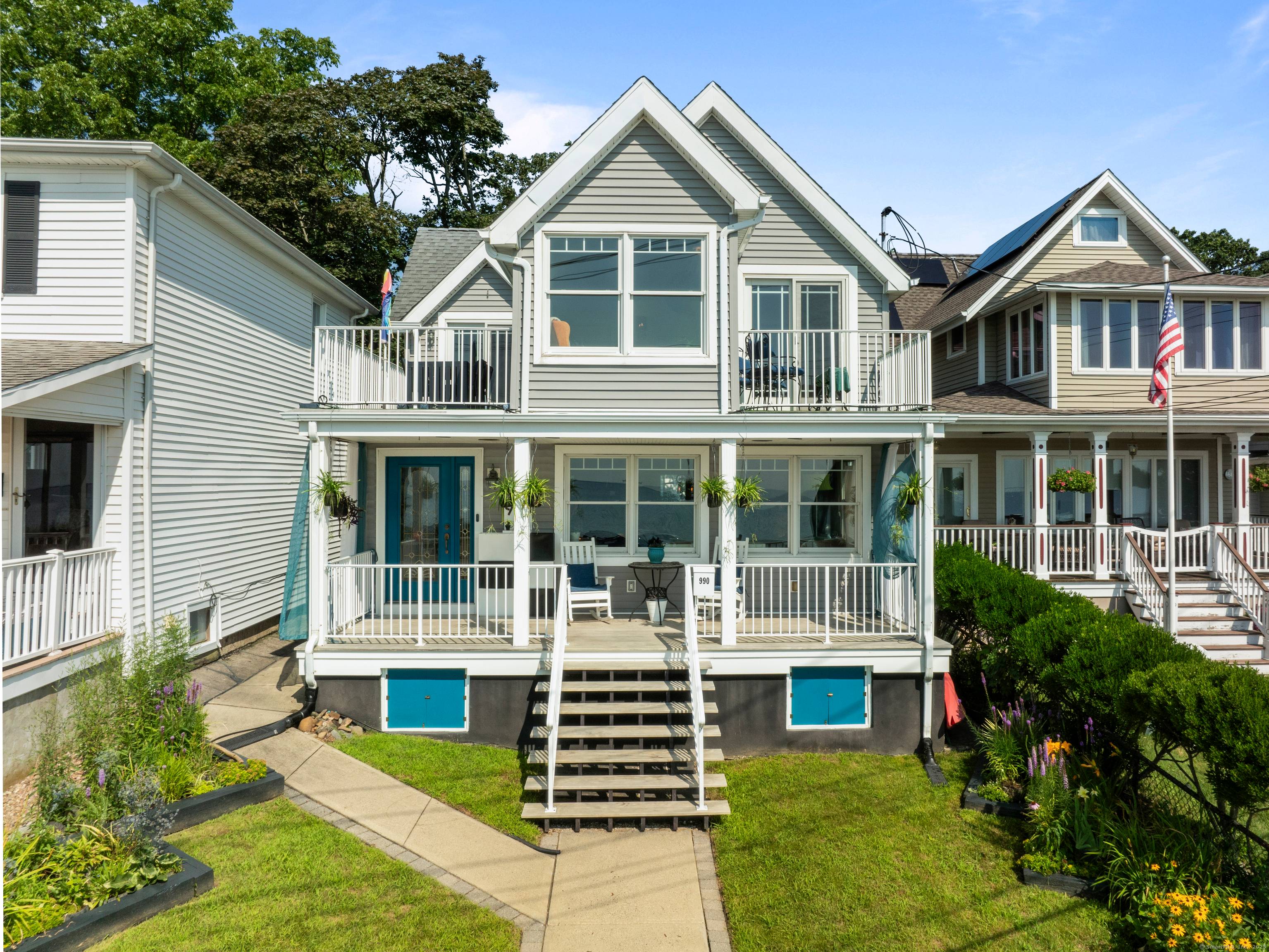 Welcome to this exceptional beachfront home offering sweeping 180 degree views of L.