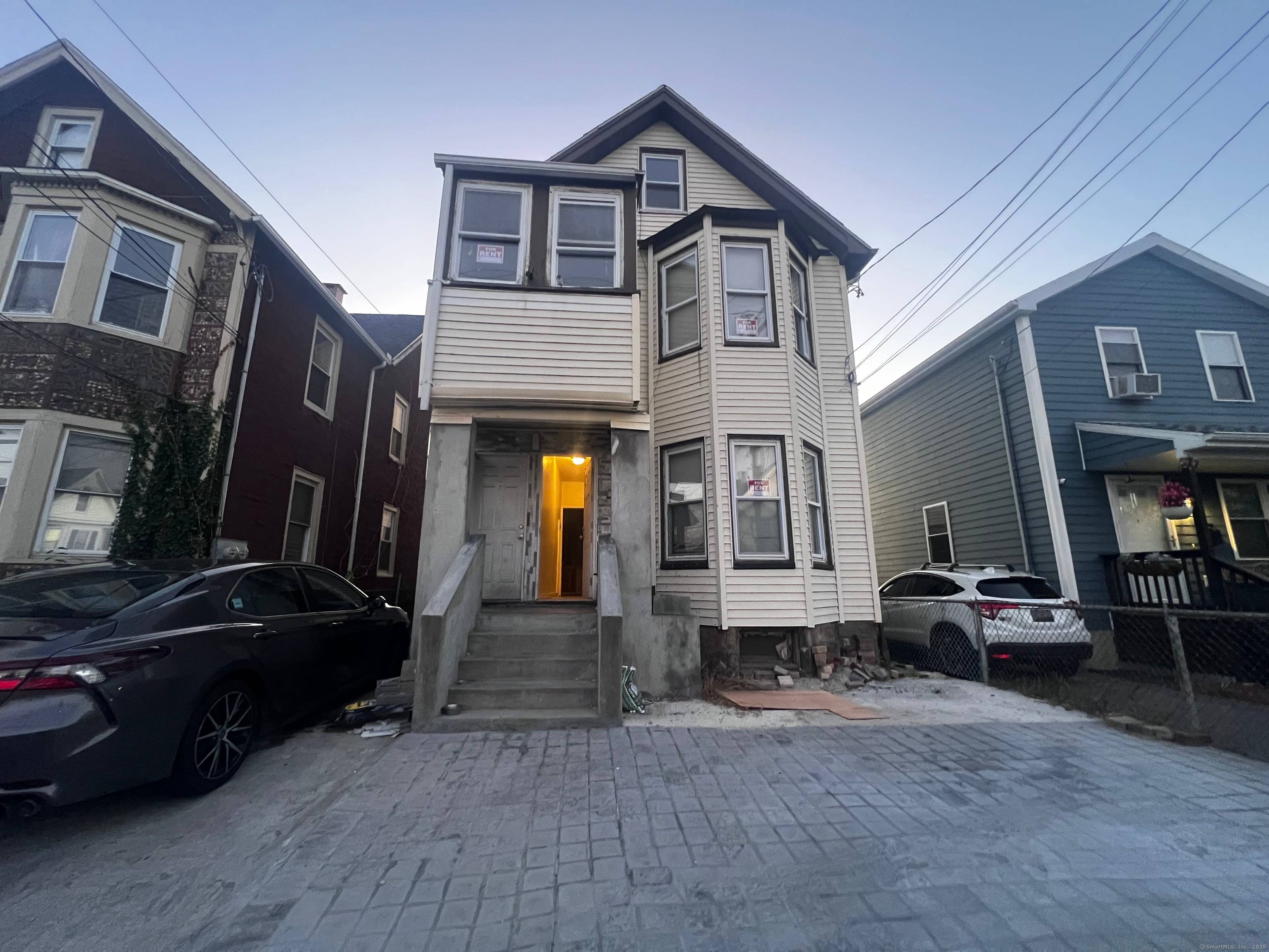 Fantastic opportunity to own this multifamily property offering two spacious units with a third floor accessory apartment !