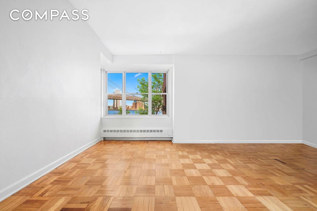 Welcome home to Residence B405 at 455 FDR Drive, a stunningly renovated three bedroom, two bathroom sanctuary offering breathtaking open views of the Williamsburg Bridge and the East River.