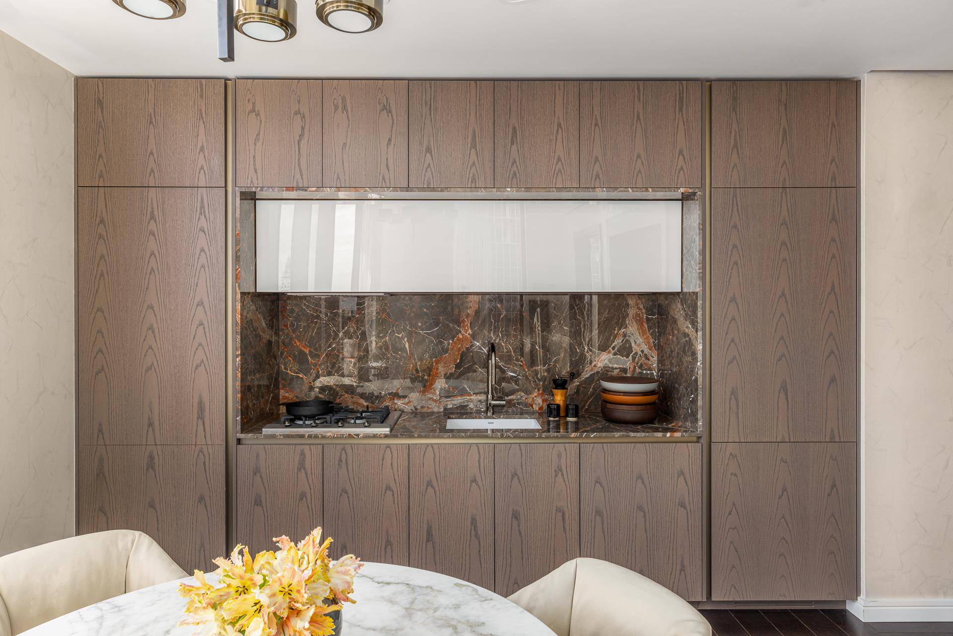 Welcome to Residence 61F at The Greenwich by Rafael Vinoly, a coveted high floor studio showcasing stunning western vistas, including panoramic views of the Hudson River and the Freedom Tower.