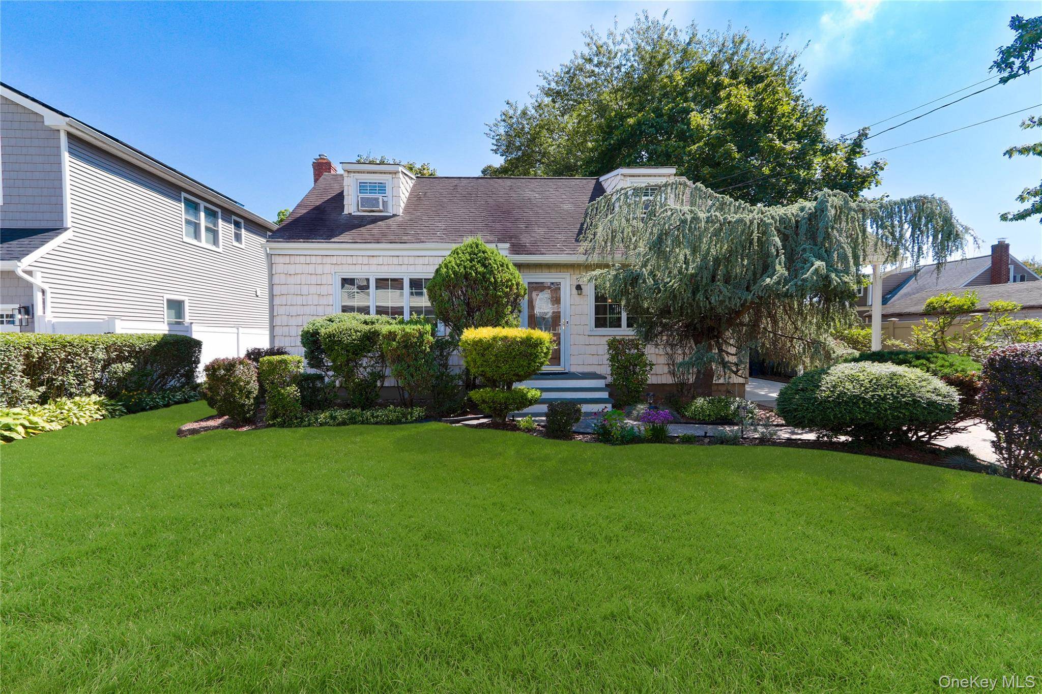 Updated Four Bedroom Cape Featuring EIK Kitchen W Gas Cooking Stainless Steel Appliances Quartz Counter Tops Kitchen Island Two Full Designer Updated Bathrooms Primary Bedroom On 1st Floor Two Large ...