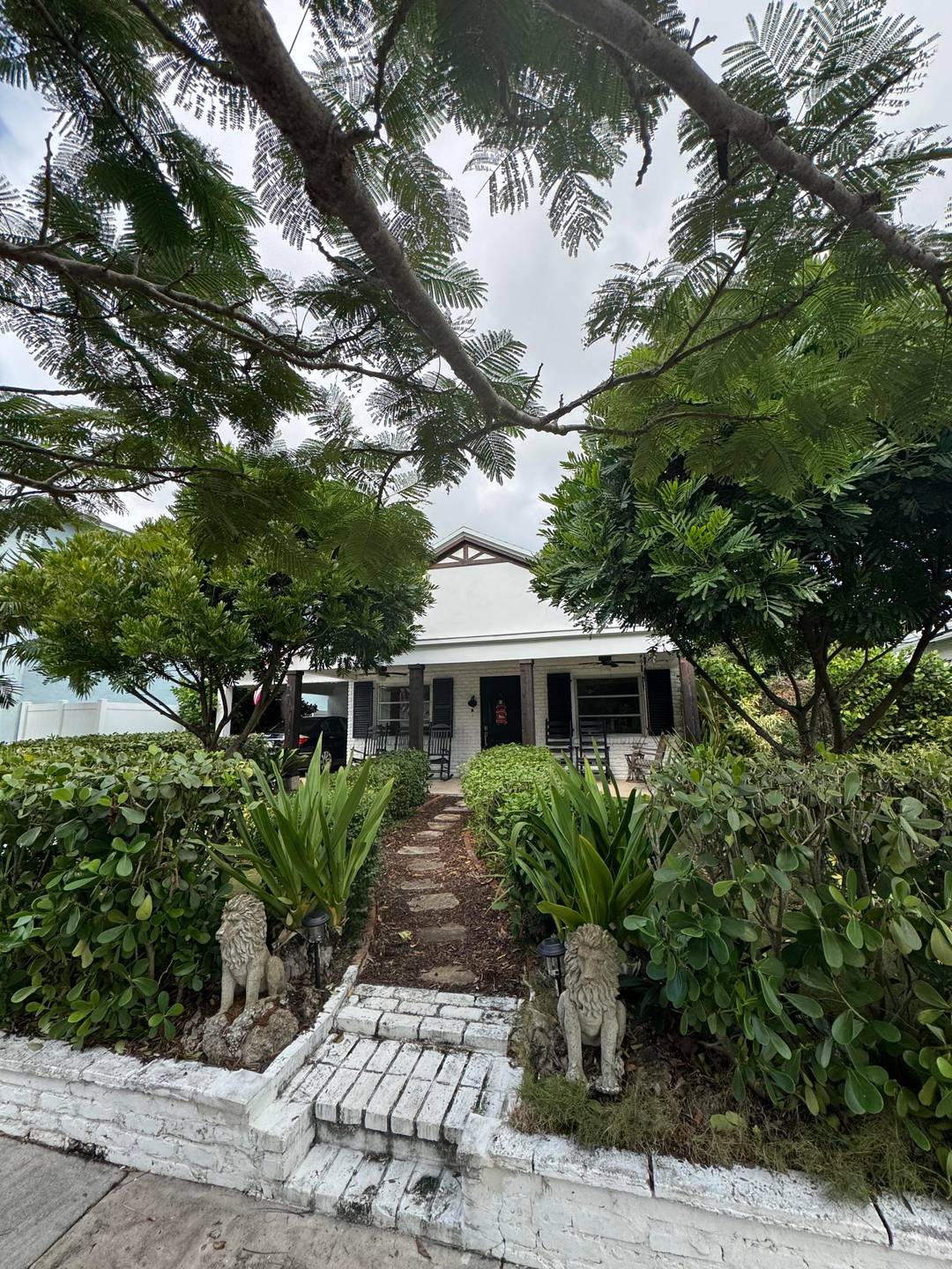 Single family home, 1 story, brick exterior, 2 2, updated bathrooms, kitchen, covered front porch, back yard with paver patio with lighting and firepit, new wood laminate flooring, all white ...