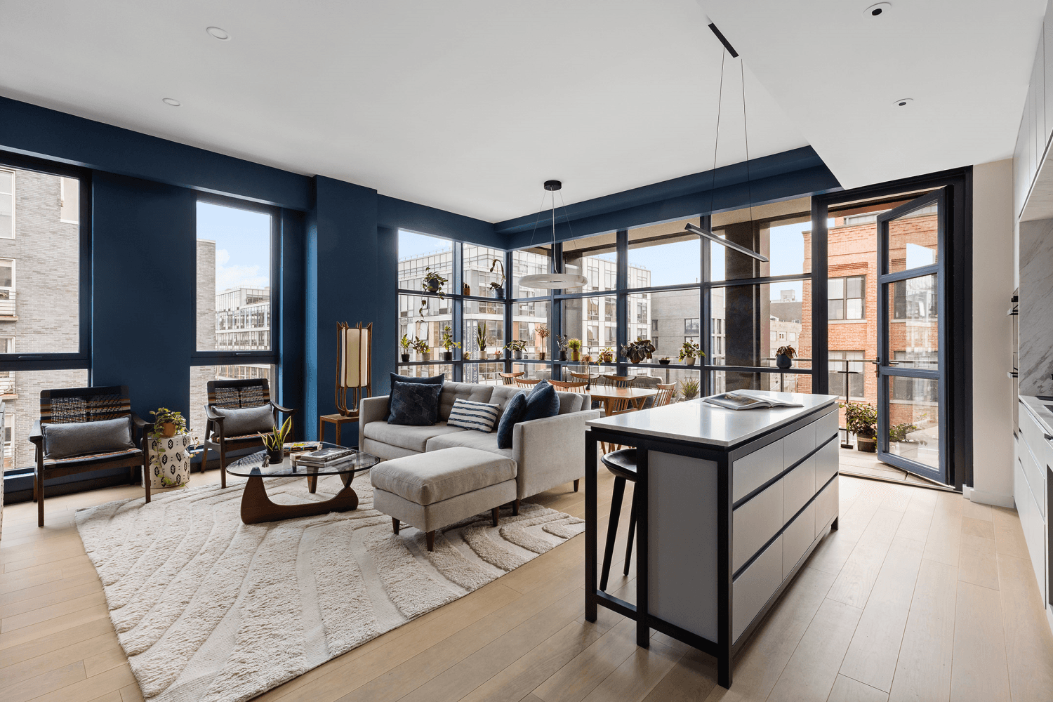 Welcome to 215 North 10th Street 4F, a corner 3 bedroom, 2 bath home featuring soaring ceilings, oversized black clad windows, and two private terraces that seamlessly connect indoor and ...