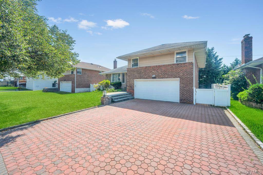 Split Style Home in Herricks School District, Renovated with updated eat in kitchen, 3 full bathrooms, Formal LR, Family Room, Finished basement, attached garage, laundry on site, private driveway.