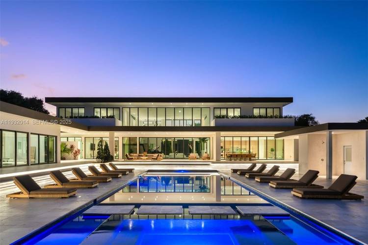An extraordinary modern estate within Southwest Ranches, this palatial modern mansion sits on 3.