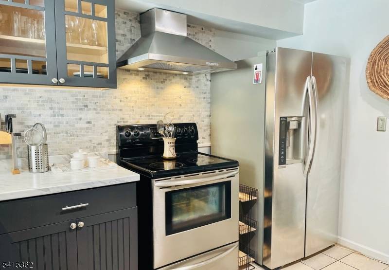 WOW ! ! SPECTACULAR EXPANDED SPLIT LEVEL, WITH CAPABILITY TO HOUSE A FEW RELATIVES IN PRIVATE SPACES.