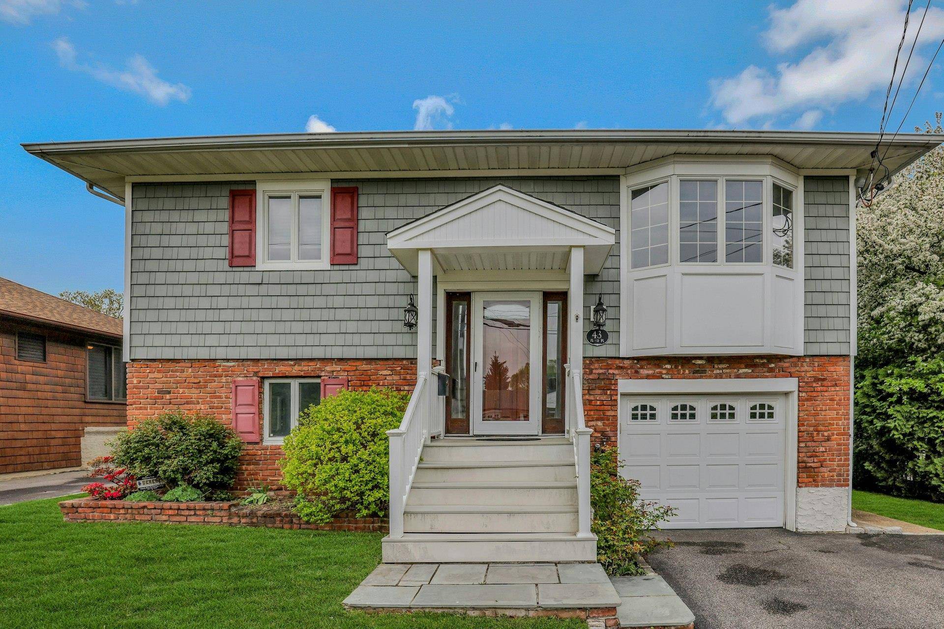 High Ranch with Bonus Lot and Oversized Garage Great Potential in East Norwich Now Offered at 928, 000 This spacious High Ranch offers 4 bedrooms and 3 full baths, with ...