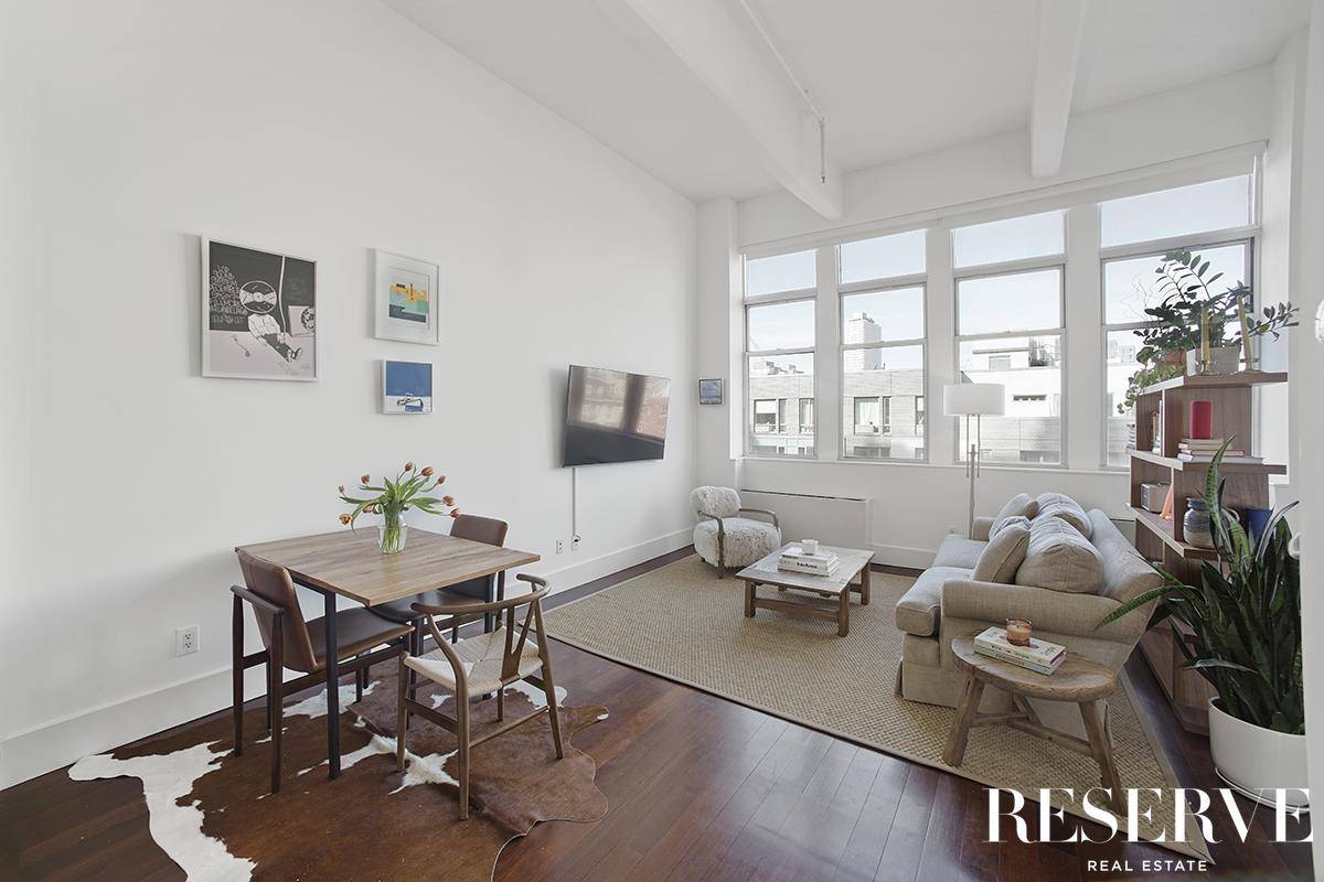 Light and living space are plentiful in this alcove studio loft in the highly sought after Gretsch Condominium.