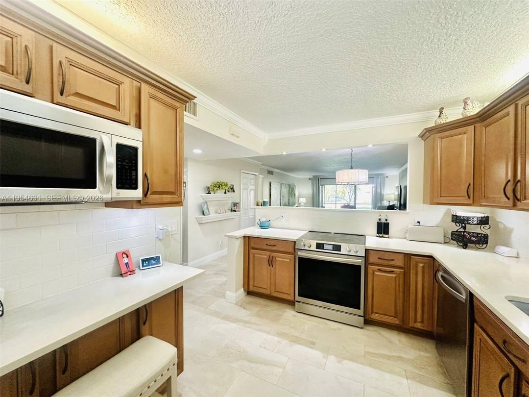 Experience a well balanced lifestyle in this beautifully updated 2 bedroom, 2 bathroom condo located in desirable Racquet Club Apartments in Weston.