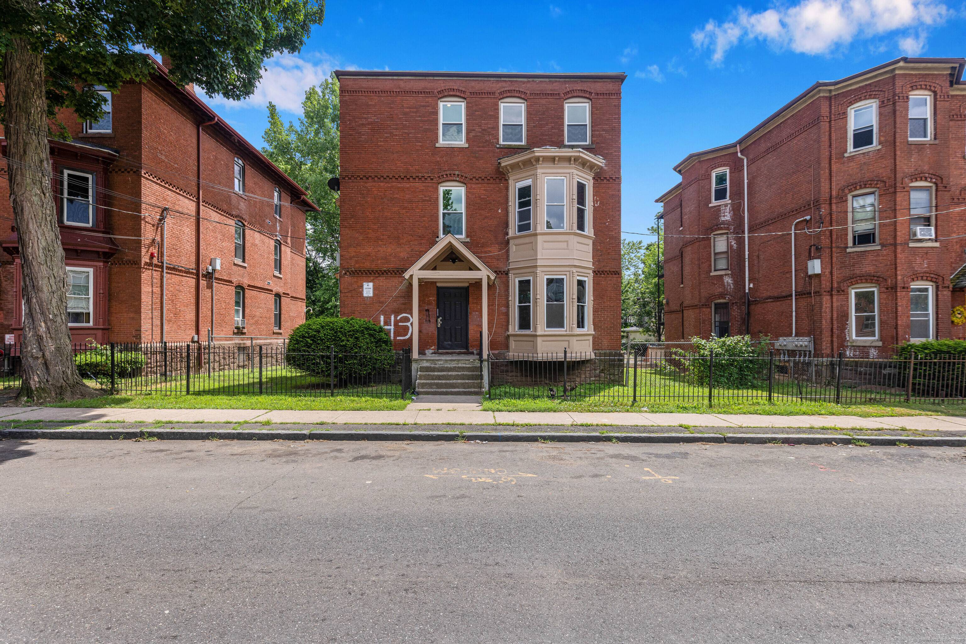 Large three family brick, one of the largest in the city boasting 4 bedrooms per unit and 1, 525 square feet per unit.
