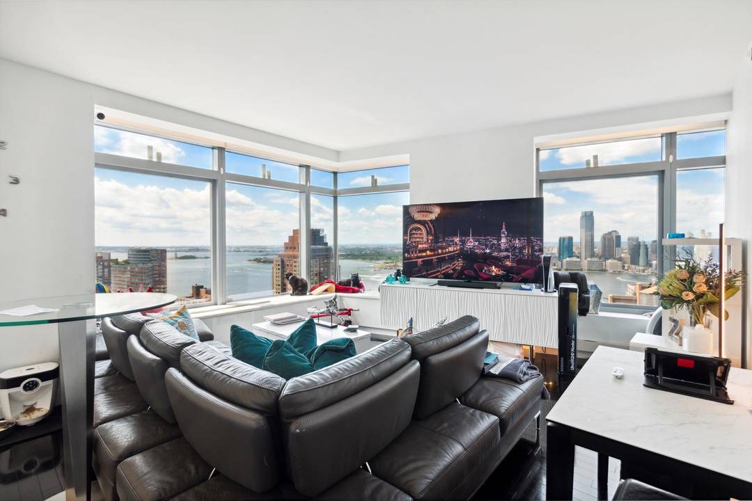 Views of 9 11 Memorial Park, Statue of Liberty, the river, city of Manhattan and beyond from every window of your residence.