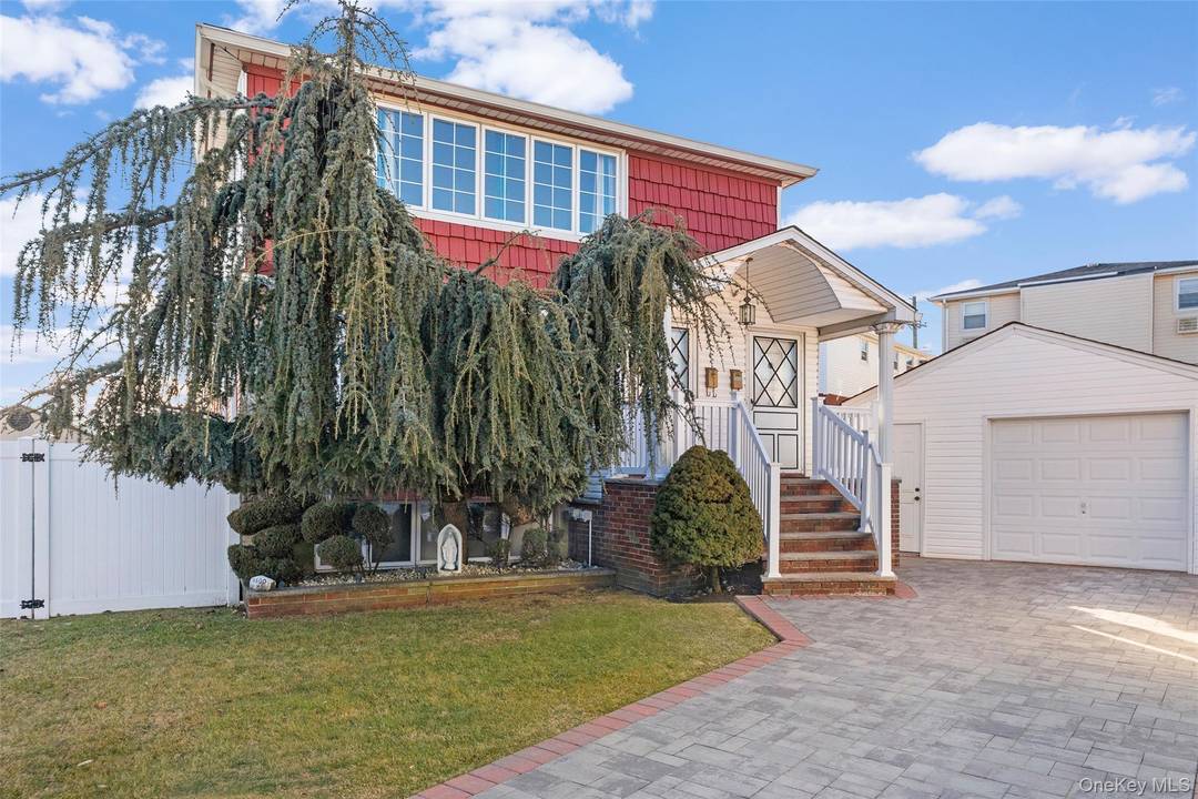 This expansive two family home in Howard Beach offers a private backyard oasis, providing the perfect blend of space, comfort, and versatility.
