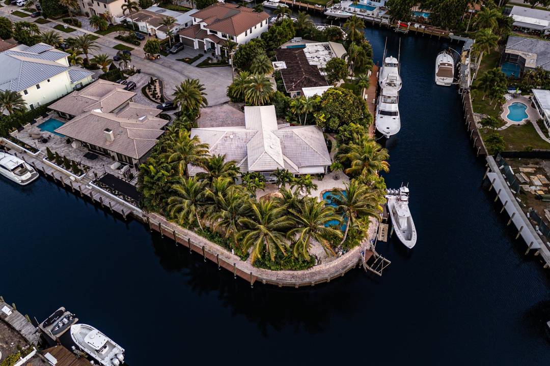 An exceptional 4 bedroom, 4 bath residence set on an impressive 242 feet of waterfront frontage, positioned on a premier point lot one of the largest currently available in Lighthouse ...