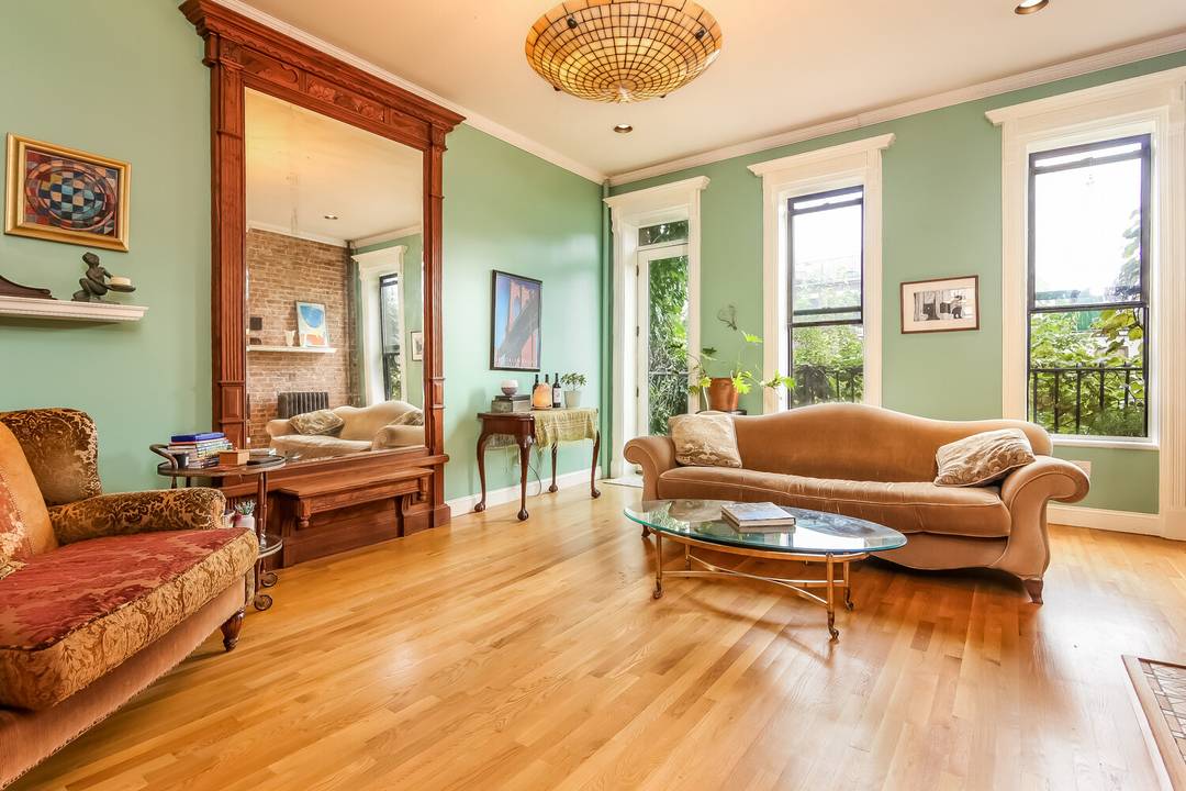 This is brownstone living done right a spacious 2 convertible 3 bedroom triplex with 12 foot ceilings, original wood details, and two private outdoor spaces, including a private roof deck ...