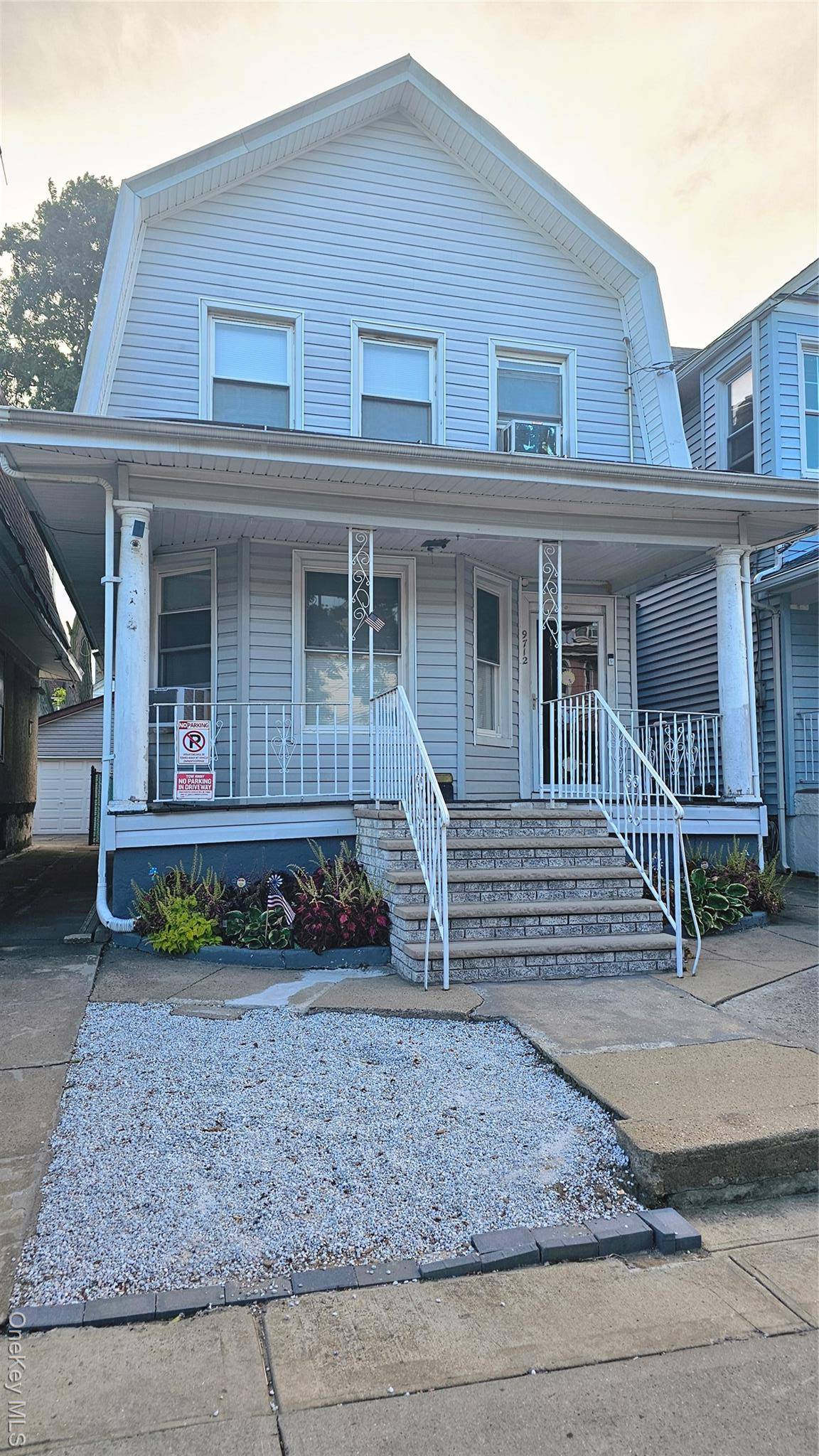 Welcome to 97 12 110th Street, a classic two story single family home that blends timeless charm with unbeatable convenience.