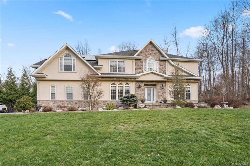 Indulge in luxury living at this resort style residence in Chester, NY, within the prestigious Monroe Woodbury School District.
