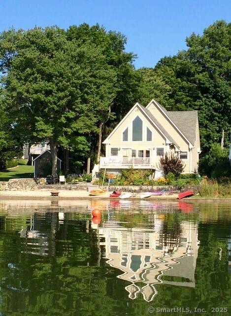 Bright and sunny Contemporary with open floor plan and natural light on Bantam Lake's quiet west shoreline.