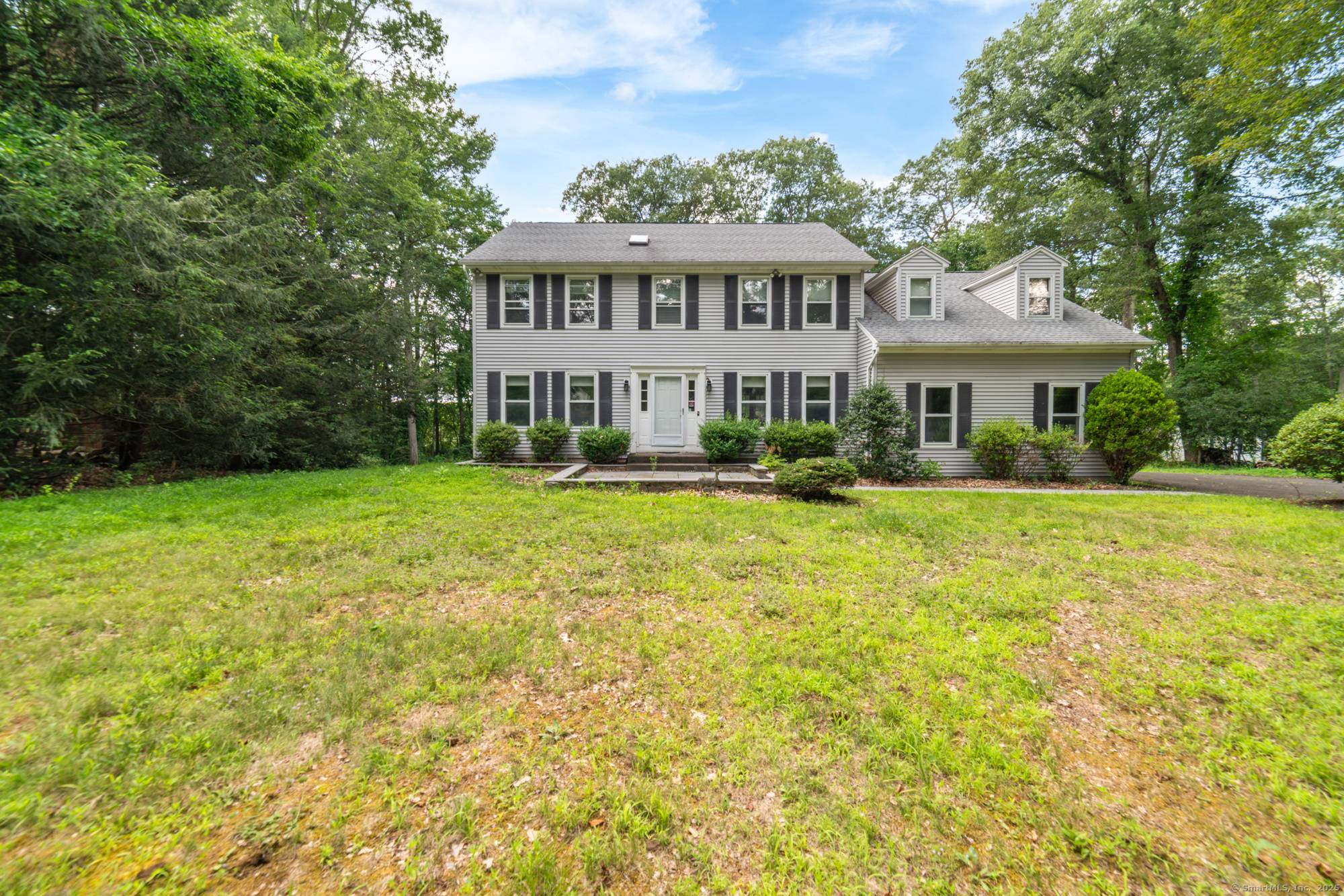 A colonial home features a spacious layout with 4 bedrooms and 2.