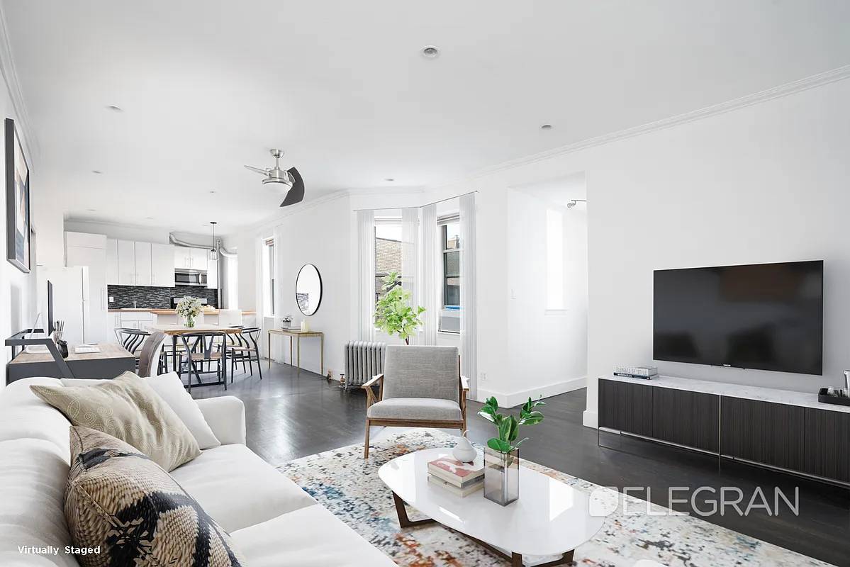 Perched atop a pre war elevator building on a tree lined block in Clinton Hill, this oversized 800 square foot apartment pairs classic charm with modern upgrades.