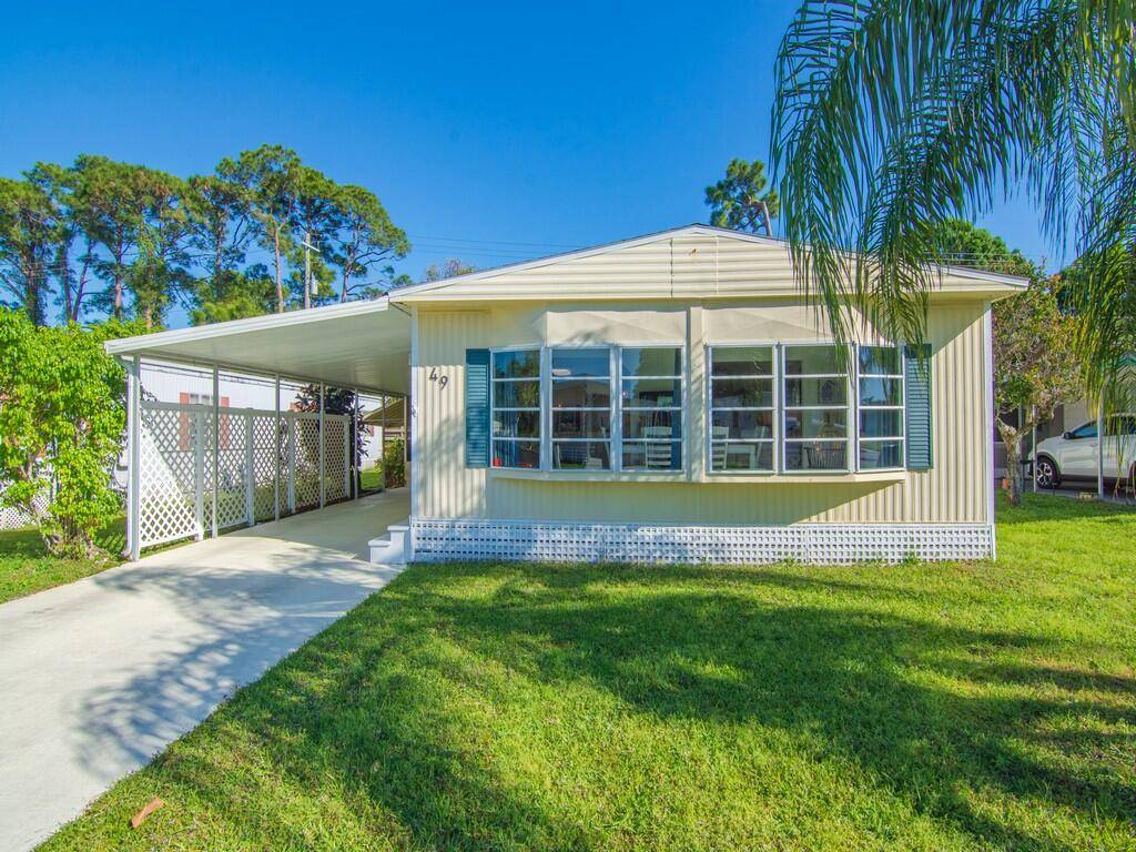 Welcome Home to 49 Camino Del Rio located in the 55 community of Spanish Lakes Riverfront.