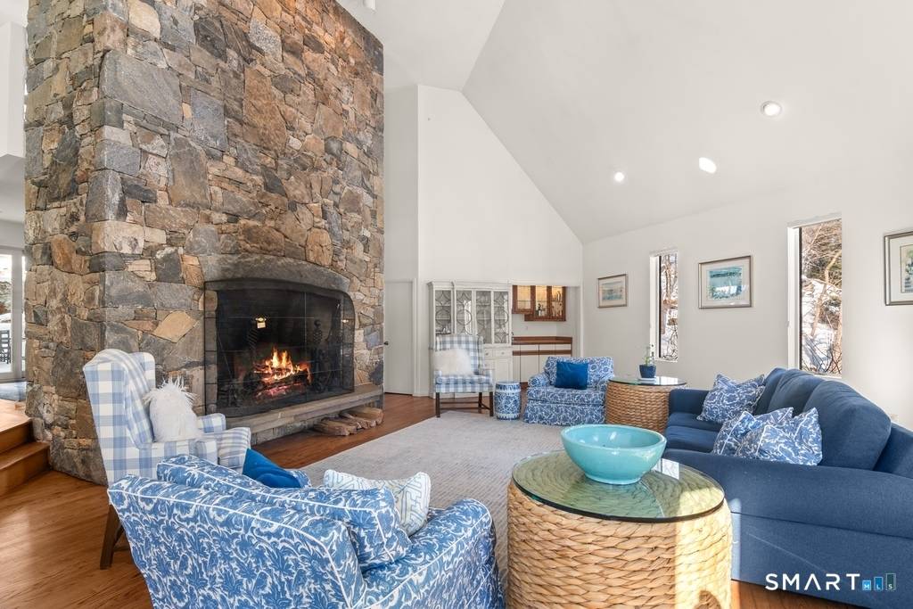 Tucked into the hillside and surrounded by nature, this contemporary Rowayton home offers far more space than meets the eye.