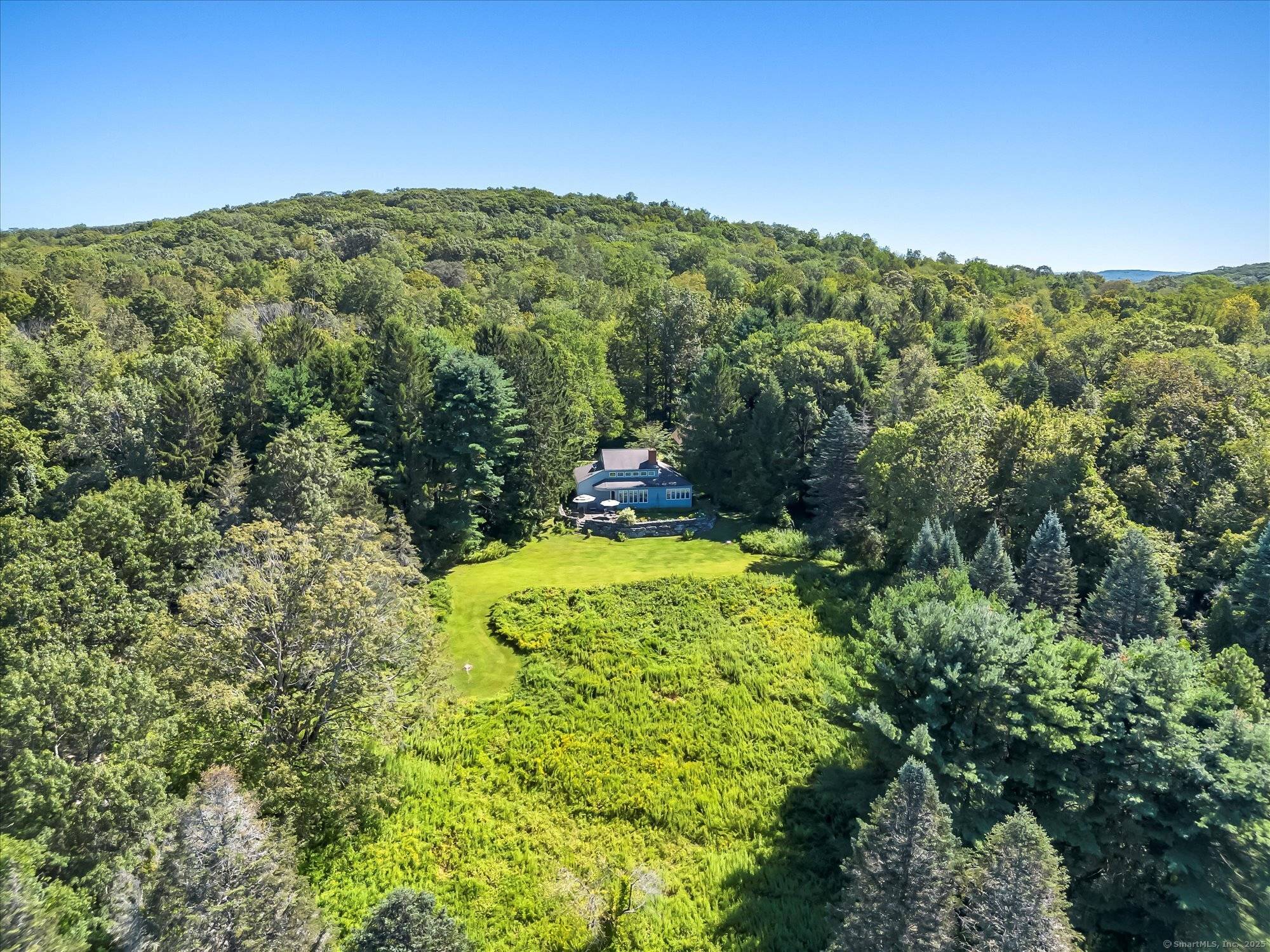 Dream retreat in South Kent on nearly 25 high acres with potential to create views of rolling hills to the west.