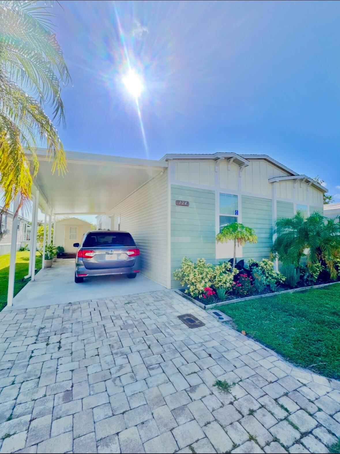 Welcome to 124 Plantation Blvd, a well maintained 2017 mobile home located in the highly sought after, all age Palm Beach Plantation community.