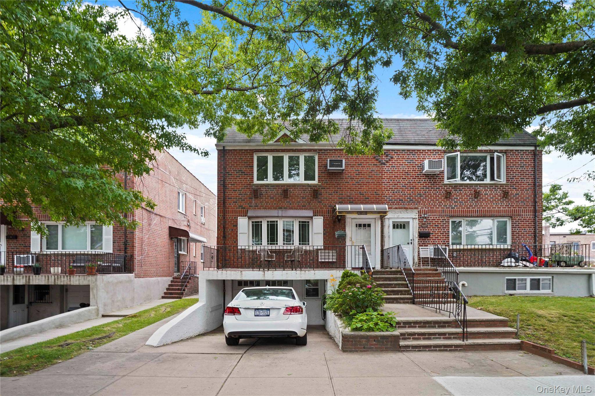 Located just one block from beautiful Juniper Valley Park, this well maintained two family semi detached brick home offers charm, space, and convenience.