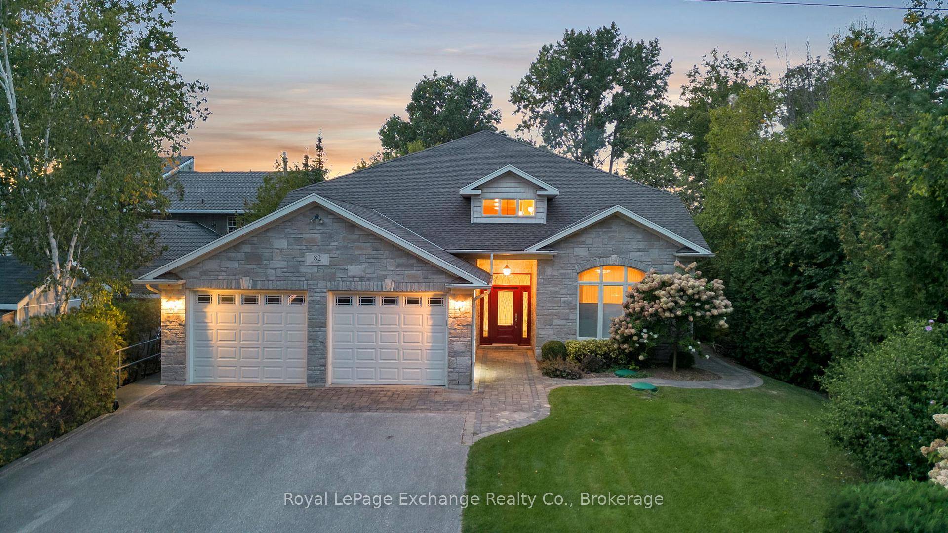 A spectacular custom built home on a beautiful 66' sandy, lakefront beach.