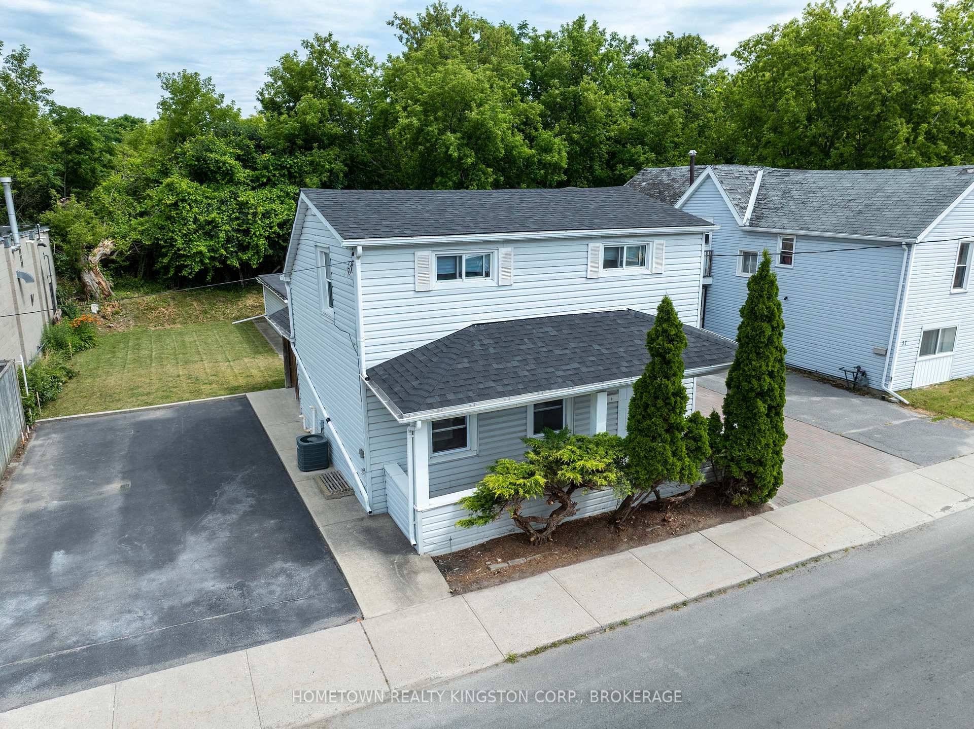 Affordable downtown property on a large city lot with 2 driveways amp ; a large detached garage workshop.